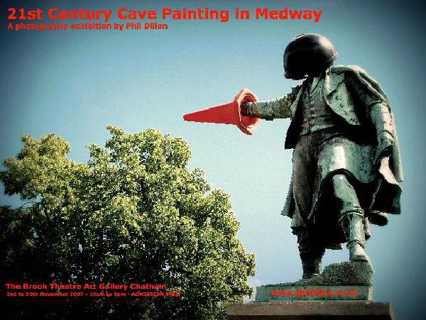 Poster for photography exhibition 21st Century Cave Painting in Medway by Phil Dillon, featuring statue holding traffic cone, at The Brook Theatre and Gallery Chatham, October 21st-29th November 2005"