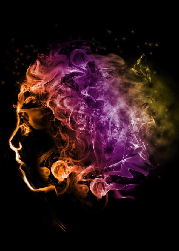 An artistic smoke photograph featuring the silhouette of a human face in left profile against a black background. The figure appears to be emitting colorful smoke that flows dramatically from left to right across the frame. The smoke transitions through a spectrum of colors—starting with warm orange tones near the face, flowing through vivid magenta and purple in the center, and dispersing into yellow-green hues on the right side. The smoke creates intricate, wispy patterns with delicate tendrils that break into stars and particles at the edges, creating a striking ethereal effect."
